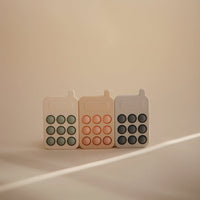 Mushie pop it telefoon blush 10 mnd+