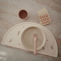 Mushie placemat pink flowers