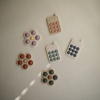 Mushie pop it telefoon cambridge blue 10 mnd+