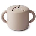 Mushie snack cup shifting sand