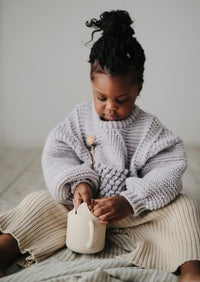 Mushie snack cup shifting sand